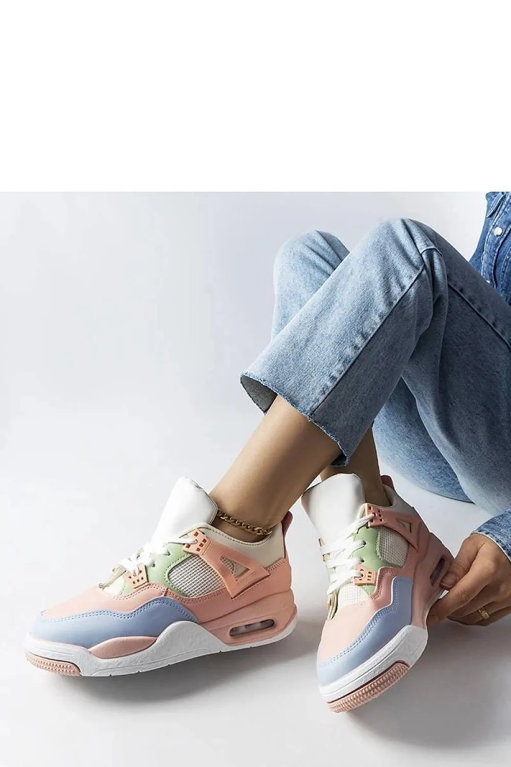 Beige sneakers on white rubber sole